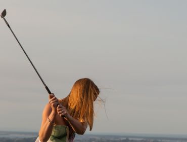 Eagle Ridge Country Estate, Wedding Venue, women swinging a golf club